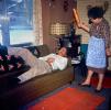 Man, Sofa, woman, apron, rug, lamp, 1960s, PARV11P12_04