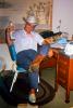 Man, Cowboy Boots, Hat, Jeans, Chair, Brook Springs Whisky Bottle, Goofing, desk, rug, Kentucky Derby Party, PARV11P13_19