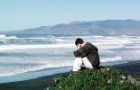 Man sits over the Pacific Ocean, Beach, Marin County, coastal, coast, shoreline, seaside, coastline, Ocean-Beach, pickleweed, PBAV02P09_09