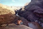 Man sitting over a cliff, Colorado River, PBAV02P09_14