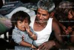 Crying Boy with smiling father, Mumbai