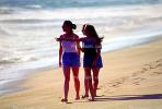 girls walking on the beach