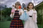 Girls showing off their Barbie Dolls, Ken, smiles, smiling, 1950s, PCDV01P15_13B