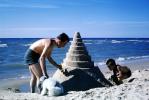 Beach, Father, Son, Cone Sand Castle, Spiral, Ocean, Water, Poodle, October 1965, 1960s, PCTV01P01_09