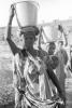 Woman carry's water bucket, Somalia Refugee Camp, child