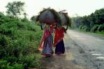 Women Carrying a bushel of Wood
