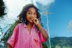 Smiling Girl carrying vegetation, Deforestation