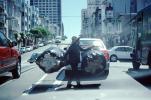 Chinese Woman with a huge load of Recyclables, California Street, cars, crossing