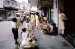 street market, sellers, vendors, shoppers, sidewalk, cars, Bangkok, Thailand, October 1962, 1960s, PDCV01P12_02