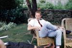 Jim Ritchie, wicker chairs, man, male, backyard, pants, tie, flatop haircut, lawn, 1950s, PDEV01P02_16