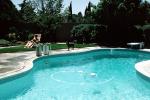 swimming pool, pleasanton california, Backyard, Lounge Chair, rock garden, wall, man, male, reading, relaxing