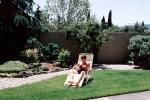 Backyard, Lounge Chair, rock garden, wall, man, male, reading, relaxing, PDEV01P05_04