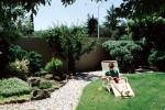 Backyard, Lounge Chair, rock garden, wall, man, male, reading, relaxing, PDEV01P05_06