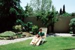 Backyard, Lounge Chair, rock garden, wall, man, male, reading, relaxing, PDEV01P05_07