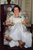 Woman sits, formal dress, smiles, corsage, 1940s, PDFV02P11_05B