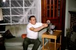 Man Preparing to show 8mm Movies, Projector, 1960s