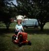 Woman on a Lawnmower, Mowing the Lawn