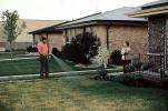 Watering the Front Lawn, homes, houses, 1970s, PDGV01P10_08