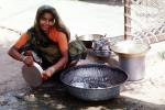 Woman washing dishes, pail, pots, pans, PDKV01P01_18