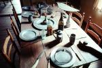 Table, Plates, setting, chairs, knife, wine bottle