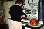 Stove, Turkey, making dinner, woman, clock, December 1962, 1960s, PDKV01P08_19