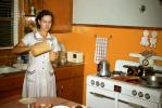 Woman in a Kitchen, Stove, Pot, accoutrements, radio, PDKV01P10_14