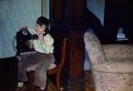 Boy on a phone, sitting, smile, pants, shirt, 1940s, PDPV01P10_19