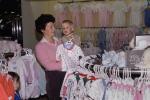 baby clothes, Shopping Mall, shoppers, window display, woman, boy, child, 1980s