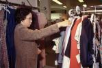 Shopping Mall, interior, inside, indoors, shoppers, clothing store, woman, racks, 1980s