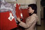 Asian Woman Shopping, interior, inside, indoors, shoppers, clothing store, racks, 1980s, PDSV04P06_17