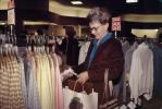 Woman Shopping, interior, inside, indoors, shopper, clothing store, racks, 1980s, PDSV04P06_18