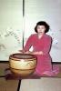 Geisha Girl warming her hands, Prostitute, Hooker, drums, drumming, Japanese Brothel, Sasebo Saga Japan, 1950s, PEIV01P02_12
