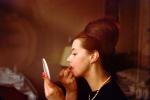 Lady Applying Lipstick, pearl necklace, bouffant hairdo, 1960s, PFBV02P03_08