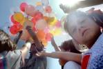 Girl, Balloons, Fun at Festival On The Lake