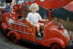 Unhappy Little Girl in a Fair Firetruck Ride, 1950s, PFFV02P11_14