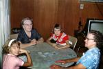 Family playing cards, card table, girls, women, grandma, 1950s, PFGV01P10_08