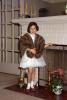 Girl in moms mink shawl, dress, fireplace, candelabra, 1950s
