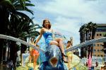 Woman sitting on a Flying Fish, Miss Universe Parade, 1955, 1950s, PFPV03P11_16