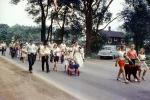 Car, strollers, dogs, men, women, girls, Pet Parade, June 12 1957, 1950s
