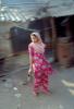 Woman Standing by a slum shack, Mumbai, PFSV01P12_04