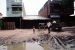 stores, dirt road, mud, cow, brama bull, cow, buildings, shops, stores, Ahmadabad, PFSV02P06_08