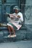 Woman, reading newspaper