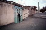 Woman, door, doorway, homes, houses, Sanandaj Iran