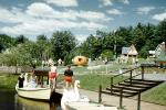 Boats, Swan, docks, pumpkin, buildings, stairs, steps, clouds, trees, Storytown, Lake George, New York, 1957, 1950s, PFTV03P07_08