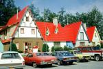 unique building, parked cars, red rooftops, Animal Land, Storytown, cars, automobiles, vehicles, 1981, 1980s
