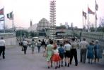 family, people walking, flagsl, NYC Worlds Fair, 1964