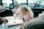 Girl Blowing out a Birthday Cake, making a wish, 1970s, PHBV02P13_02