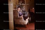 Woman, tree, chair, decorations, tinsel, 1940s
