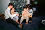 Christmas Tree decorated, decorations, woman sitting, boys, father mother, retro, 1940s
