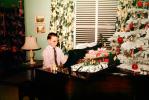 Boy Playing Piano, lamp, presents, Decorated Tree, 1950s
